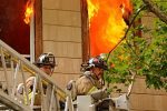 Firefighters in front of fire Thumbnail