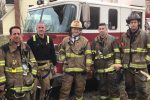 Firefighters posing in front of fire truck Thumbnail