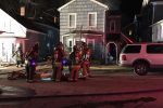 Firefighters in front of house Thumbnail
