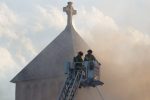 Firefighter putting out a church fire Thumbnail