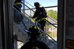 Firefighters entering a building Thumbnail