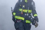 Firefighter walking through smoke Thumbnail
